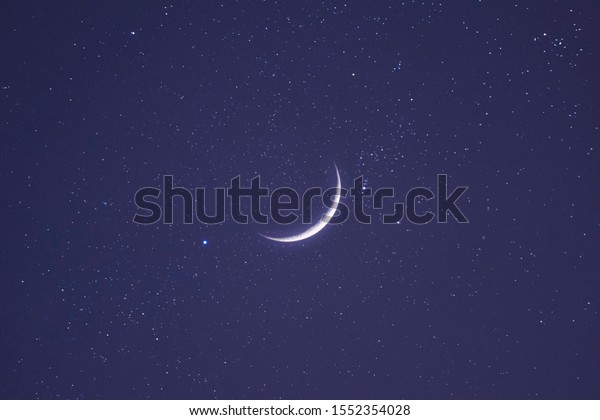 The\
background image of the half moon in the\
daytime