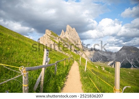 background image, a hiking trial up to the Seceda mountain peak, Dolomites, Italy