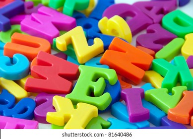 Background Image Of Magnetic Alphabet Letters.