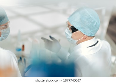 Background Image Of Medical Colleagues Talking In The Lab.