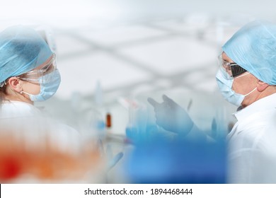 Background Image Of Medical Colleagues Talking In The Lab.