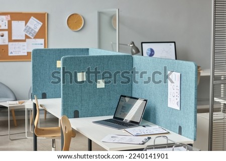 Background image of office interior with workplaces separated by partition walls, cubicles with desks, copy space