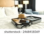 Background image of packed suitcase with passport and tickets on bed ready for travel concept