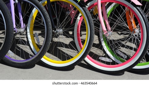 Background image shows a group of colorful bicycles.  Bikes are for rent in Bozeman, Montana.