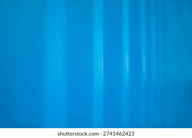 Background image of the side of a container, ribbed surface of a blue container