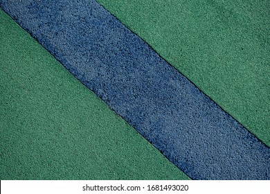 Background image of a soft, shockproof, rubber floor surface. Wallpaper. Substrate for text. Detailed texture of the rubber surface of the playground. Idea for exterior and interior. Top view.