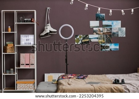 Background image of teenagers room interior with hobbie items on maroon wall, copy space