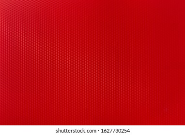 Background Image Of A Textured Red Plastic Glossy Sheet In A Cage