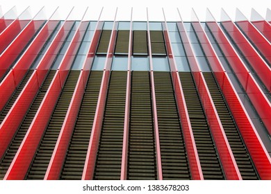 Background image - vertically stretching up decorative panels in red with black bars between them.