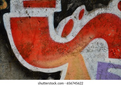 Background image of the wall decorated with colorful abstract graffiti. Street art concept