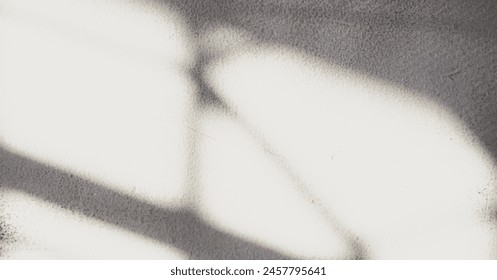 Background image of a wall with shadows from a window cast by the afternoon sunlight, creating a warm and serene ambiance.
