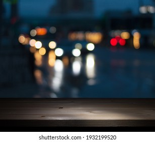 Background Image Of A Wooden Bar Counter By The Window In A Pub In Front Of Abstract Blurred Lights Of The Night City 