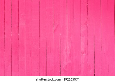 Background image of a wooden wall painted in bright pink color