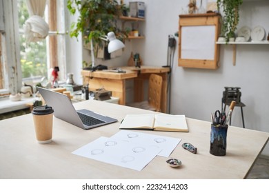 Background image of workplace with designs and computer in workshop studio, copy space