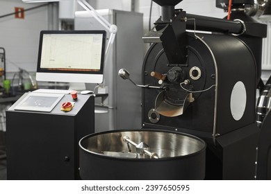 Background of industrial coffee roaster in workshop of food factory, copy space