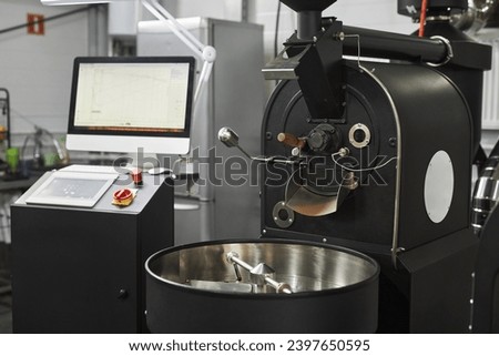 Background of industrial coffee roaster in workshop of food factory, copy space