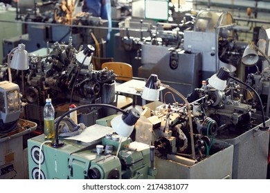 Background Of Industrial Manual Machines With Flexible Lamps In Line, Old Factory Concept