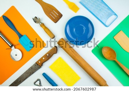Background of kitchen utensils on white wooden kitchen table. tools. Top view.