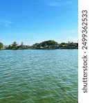 The background of lakes and trees all around the estate