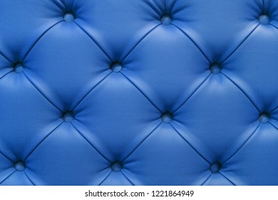 Background of leather blue sofa, stitched buttons. - Powered by Shutterstock