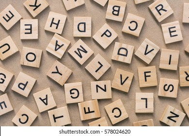 background of  letterpress wood type printing blocks, random letters of alphabet and punctuation stained by black inks - Shutterstock ID 578024620