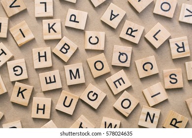 background of  letterpress wood type printing blocks, random letters of alphabet and punctuation stained by black inks - Shutterstock ID 578024635