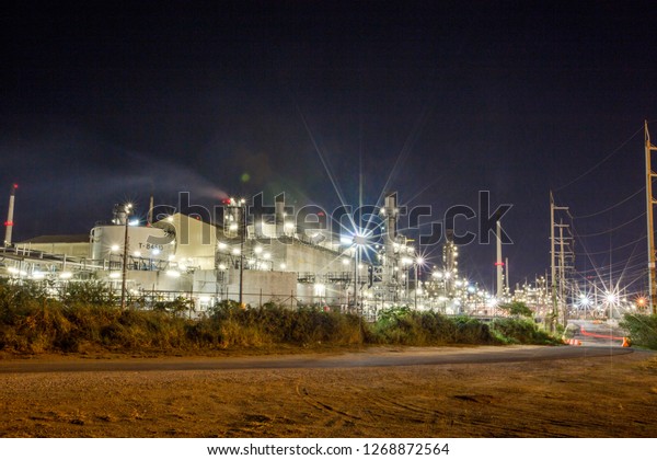 The background of\
the light from the gas refinery, with the light from the fire and\
the blending of the oil mixed together, mostly in the industrial\
and energy production areas