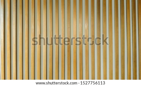 Background of the long wood texture that has been smoothly lacquered with orange