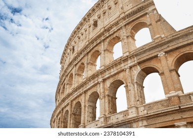 Background made of Colosseum with blue sky and clouds. Rome. Italy. Horizontally. 