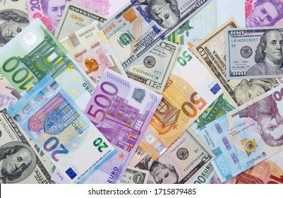 Background made of dollar, euro and hryvnia banknotes 