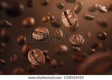 Background made of falling down fresh coffee beans with copy space