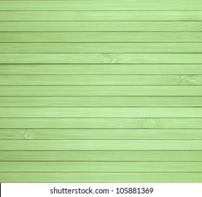 Background made of horizontal green bamboo laths.