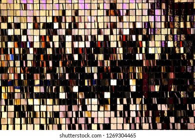 Background made of small square mirrors. Festive concept. Close up.
