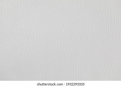 The background is made of white cattle leather.