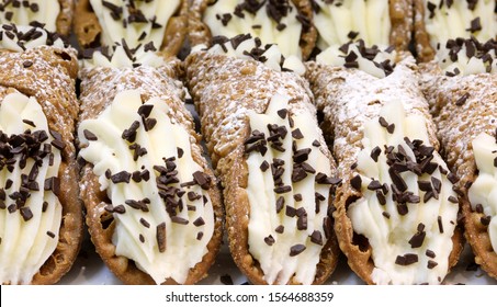 background of many pastry items called Sicilian Cannoli typical cake of Palermo and Sicily in Italy