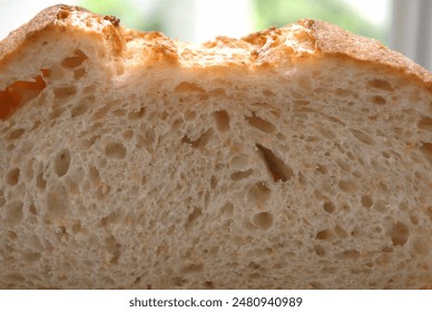Background material of a cross section of freshly baked bread cut in half.