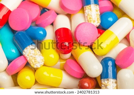 background of medical pills of different colors