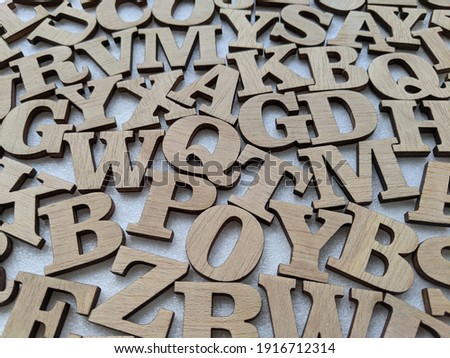 background with messy wooden alphabet