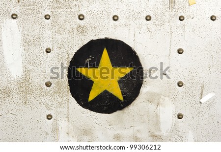 Background with a metal nut attached to the wall. Old and rusty.