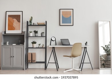 Background Of Minimal Home Office Workplace In Modern Apartment Decorated By Plants And Abstract Art, Copy Space