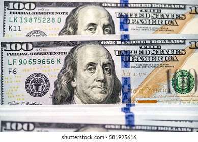 Background of a modern 100 dollar bills, large picture of the stack of hundred dollars