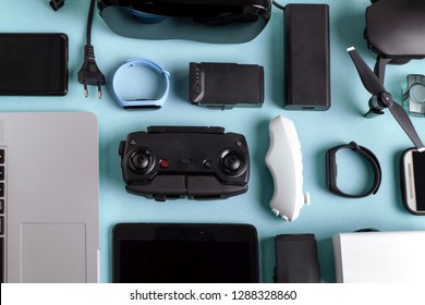 background of modern gadgets on a blue surface