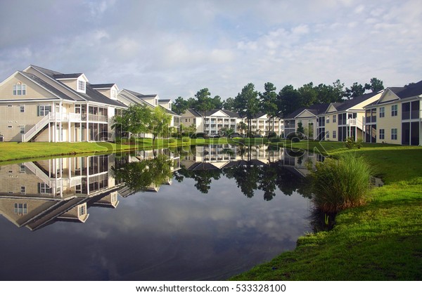 Background Modern Neighborhood Buildings Around Pond Stock Photo 