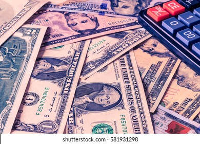 Background with money american dollar bills and black calculator. Cash money.