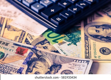 Background with money american dollar and euro bills, che and black calculator. Cash money.