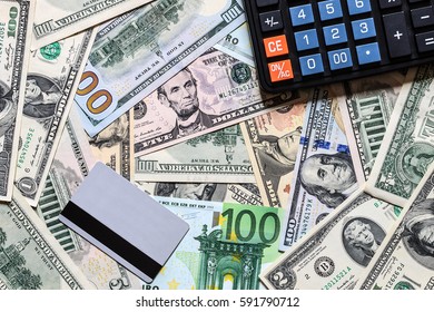 Background with money american dollar and euro bills, credit card and black calculator. Cash money.