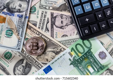 Background with money american dollar and euro bills, bitcoin and black calculator. Cash money.