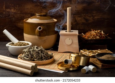 Background of moxibustion and Chinese herbal medicine.English Translation:Traditional Chinese medicine is used in the prevention and treatment of diseases, has the function of rehabilitation. - Shutterstock ID 2172054233
