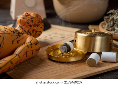 Background of moxibustion and Chinese herbal medicine.English Translation:Traditional Chinese medicine is used in the prevention and treatment of diseases, has the function of rehabilitation. - Shutterstock ID 2172469239