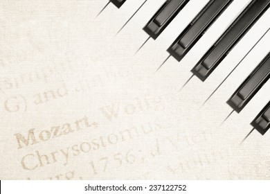 Background Of Mozart Text On Antique Paper With Piano Keys